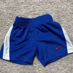 Nike Blue Shorts with White Side Panels and Red Swoosh